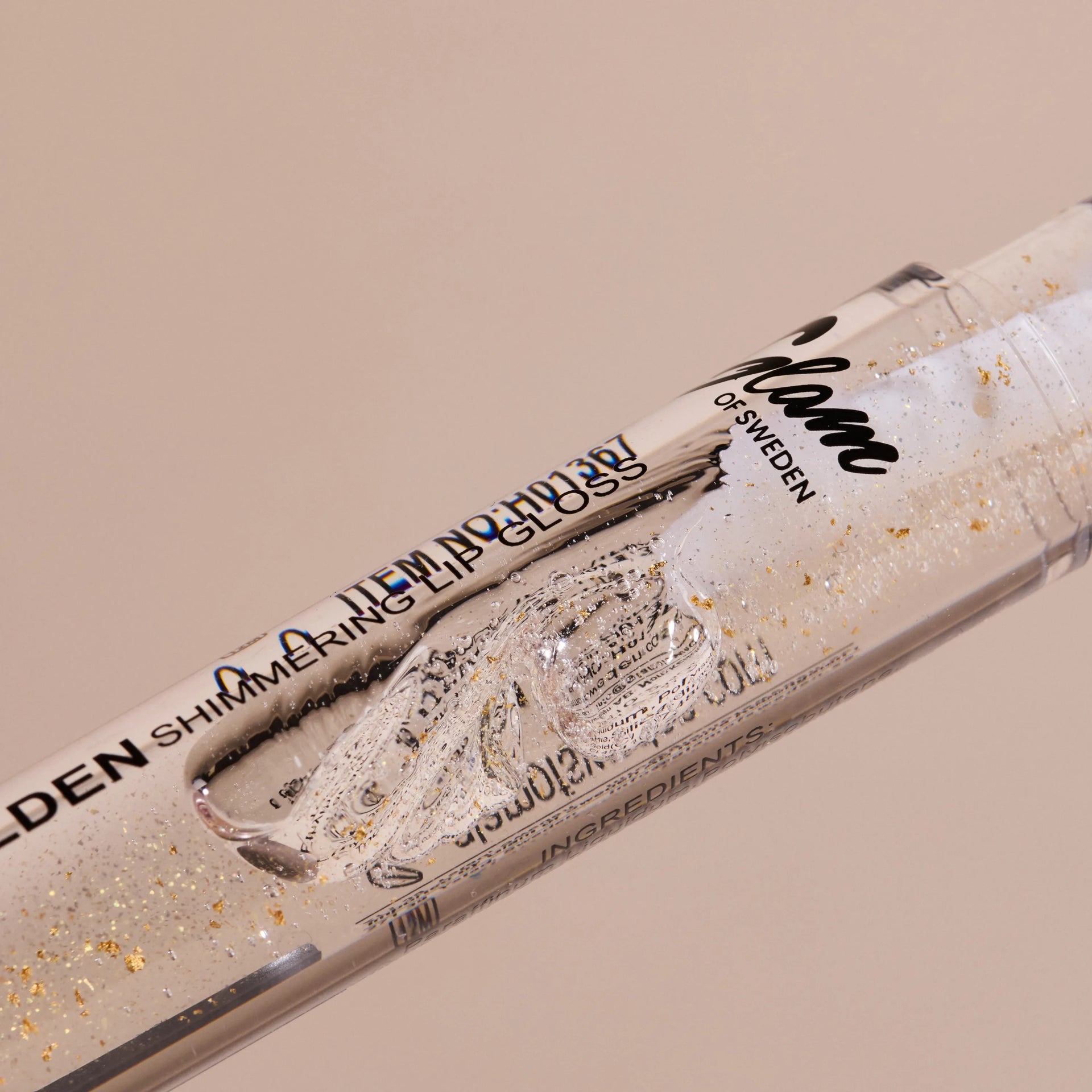 Golden shimmering lipgloss - Glamofsweden