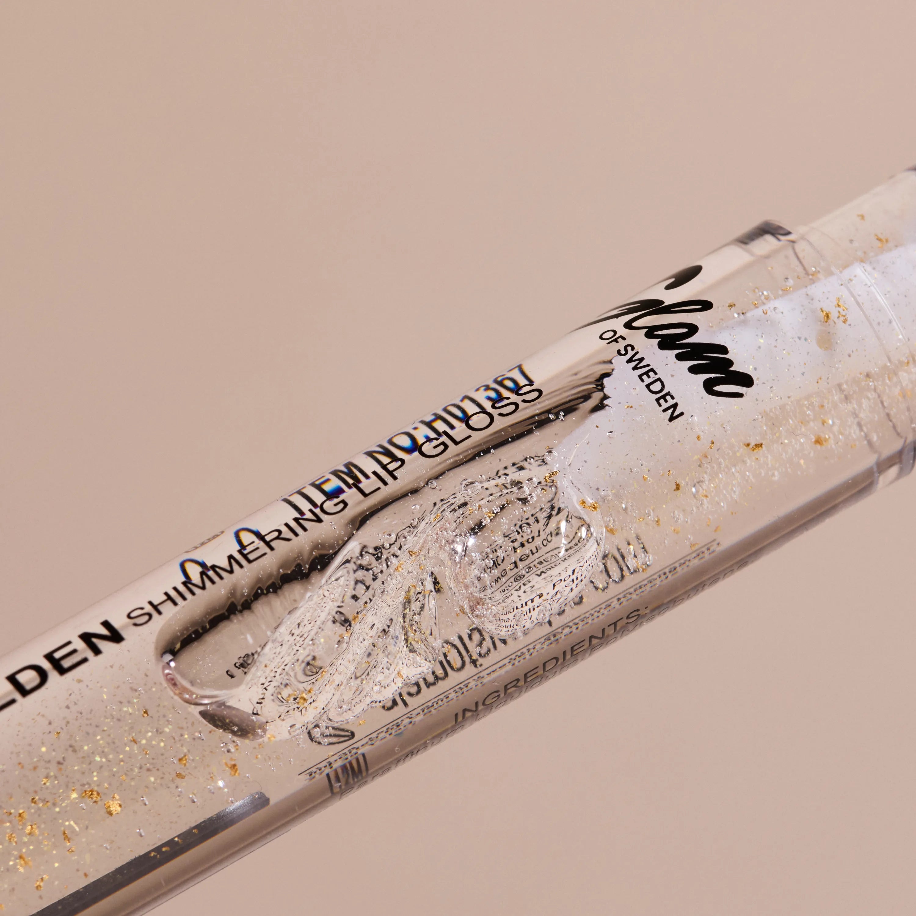 Golden shimmering lipgloss - Glamofsweden