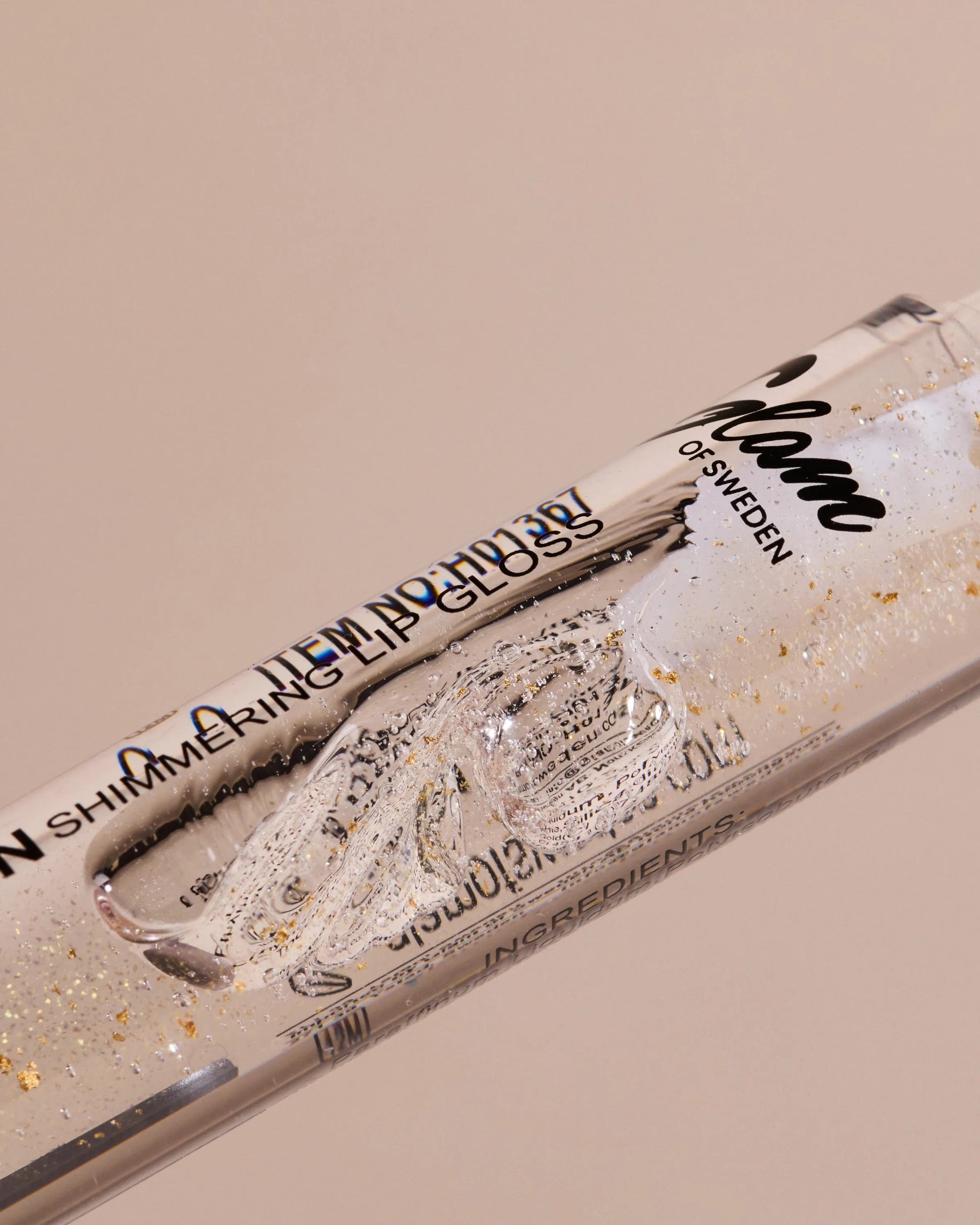 Golden shimmering lipgloss - Glamofsweden