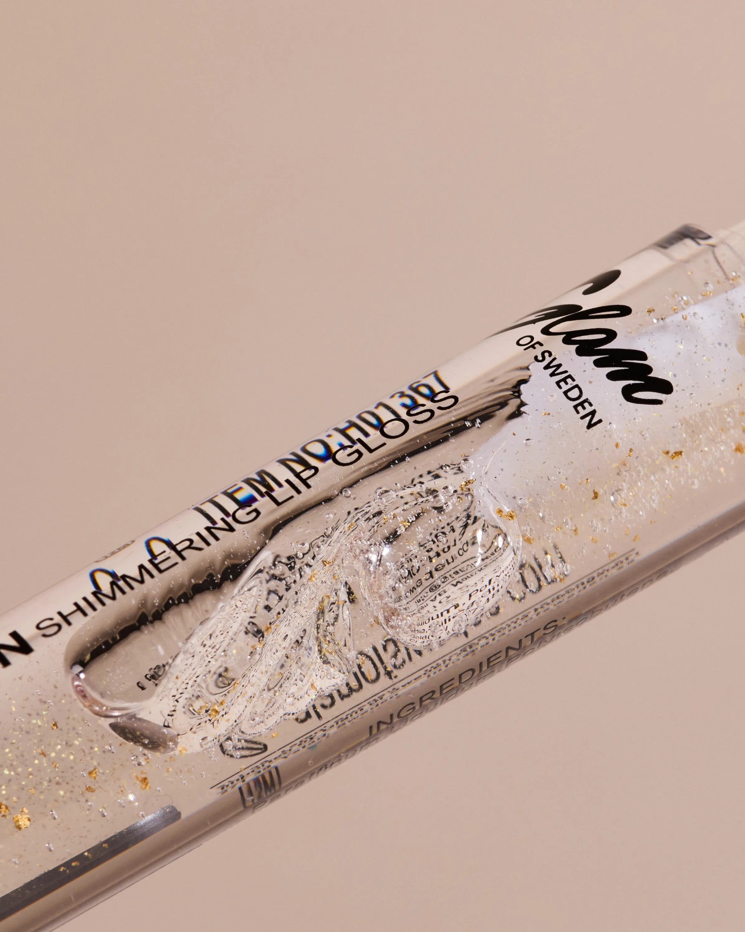 Golden shimmering lipgloss - Glamofsweden